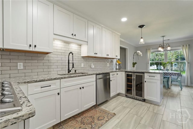 510 Braves Field Dr, Guyton, GA 31312 - kitchen with wine cooler, a sink, appliances with stainless steel finishes, crown molding, and white cabinetry