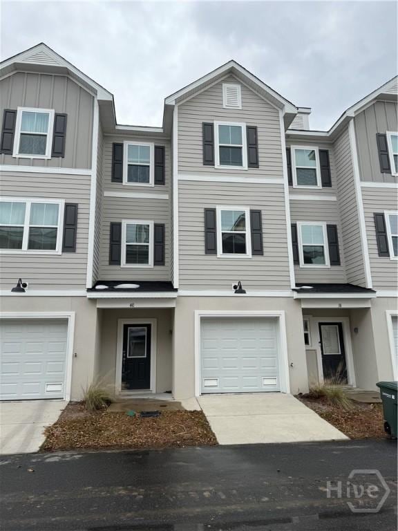 40 Hidden Pointe Dr, Savannah, GA 31419 - townhome / multi-family property with an attached garage, driveway, and stucco siding