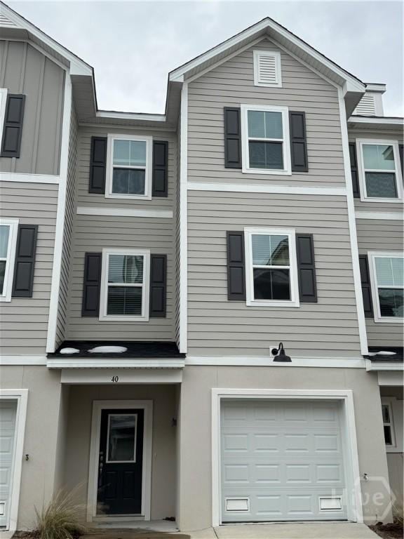 40 Hidden Pointe Dr, Savannah, GA 31419 - view of property with an attached garage, stucco siding, and driveway
