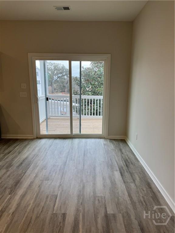 40 Hidden Pointe Dr, Savannah, GA 31419 - empty room featuring wood finished floors, healthy amount of natural light, and baseboards