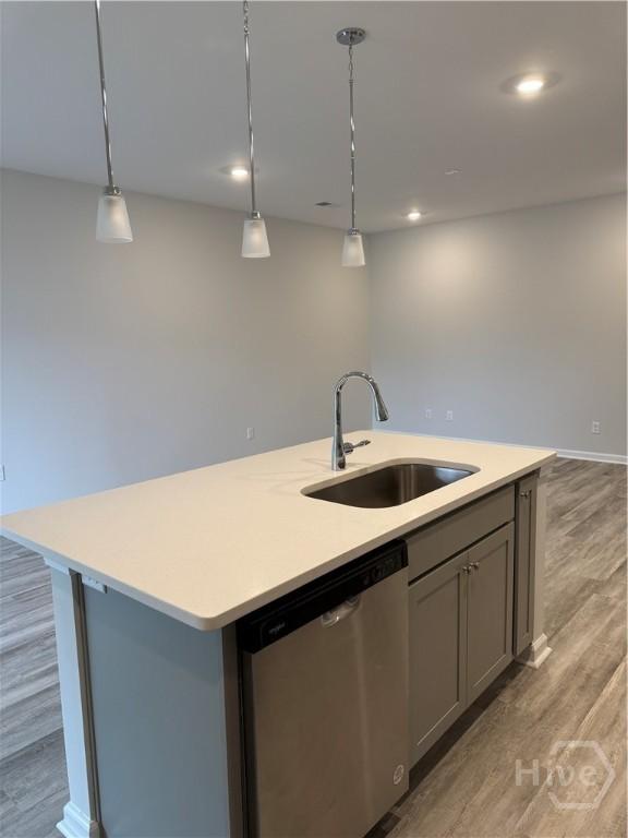 40 Hidden Pointe Dr, Savannah, GA 31419 - kitchen with stainless steel dishwasher, a sink, light countertops, gray cabinetry, and recessed lighting