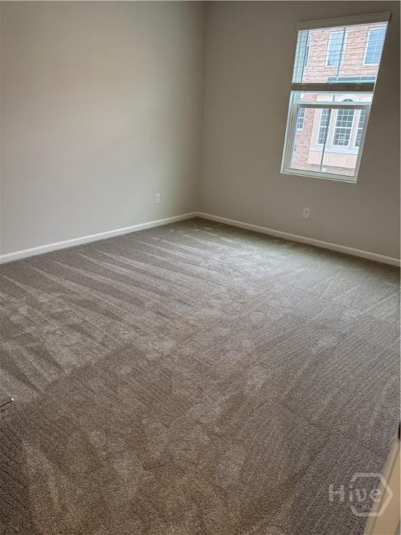 40 Hidden Pointe Dr, Savannah, GA 31419 - unfurnished room featuring baseboards and dark colored carpet