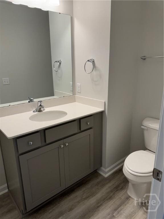 40 Hidden Pointe Dr, Savannah, GA 31419 - bathroom featuring vanity, wood finished floors, toilet, and baseboards