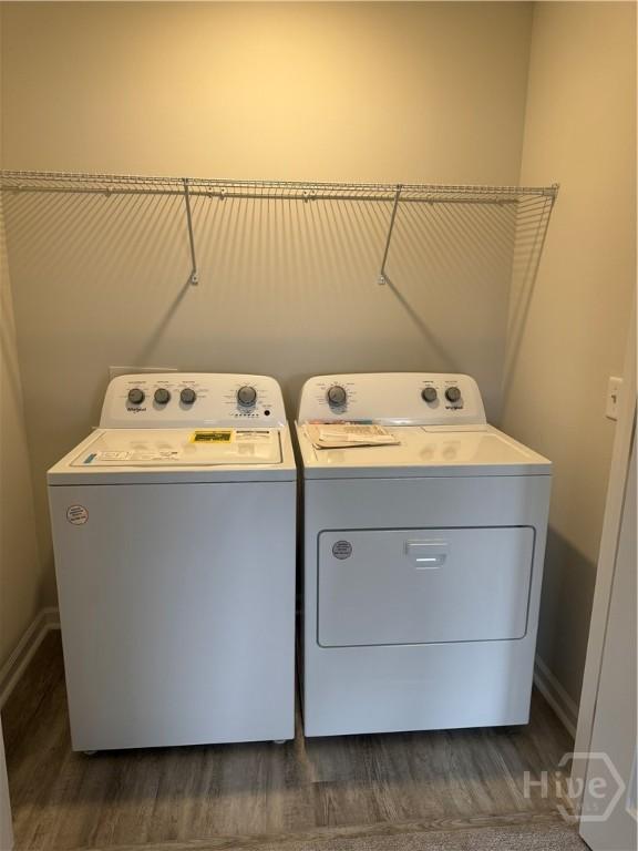 40 Hidden Pointe Dr, Savannah, GA 31419 - washroom featuring washer and clothes dryer, dark wood-type flooring, and baseboards