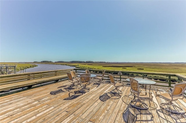 12300 Apache Ave Unit 1206, Savannah, GA 31419 - wooden terrace with a water view and outdoor dining space