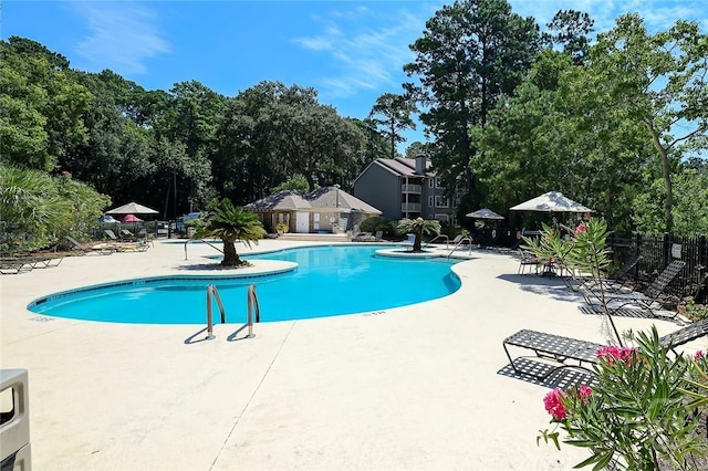 12300 Apache Ave Unit 1206, Savannah, GA 31419 - community pool with a patio and view of wooded area