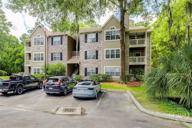 12300 Apache Ave Unit 1206, Savannah, GA 31419 - view of building exterior featuring uncovered parking