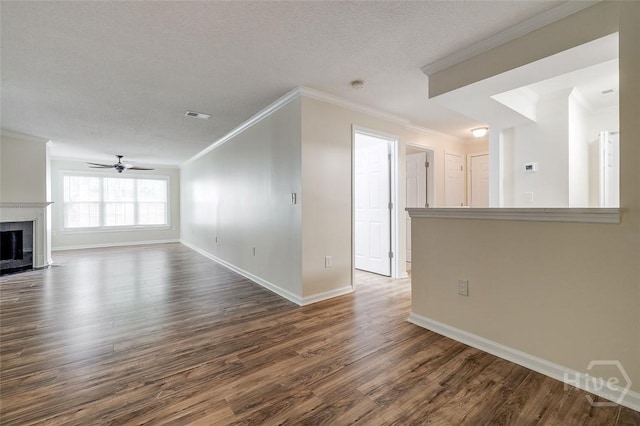 12300 Apache Ave Unit 1206, Savannah, GA 31419 - unfurnished living room with ornamental molding, dark wood-style flooring, baseboards, a ceiling fan, and a tiled fireplace