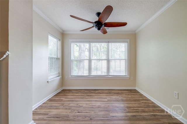 12300 Apache Ave Unit 1206, Savannah, GA 31419 - spare room with a ceiling fan, wood finished floors, a textured ceiling, ornamental molding, and baseboards