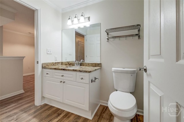 12300 Apache Ave Unit 1206, Savannah, GA 31419 - bathroom with wood finished floors, vanity, ornamental molding, toilet, and baseboards