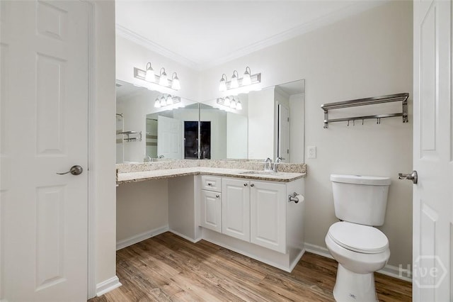 12300 Apache Ave Unit 1206, Savannah, GA 31419 - bathroom with wood finished floors, vanity, ornamental molding, toilet, and baseboards