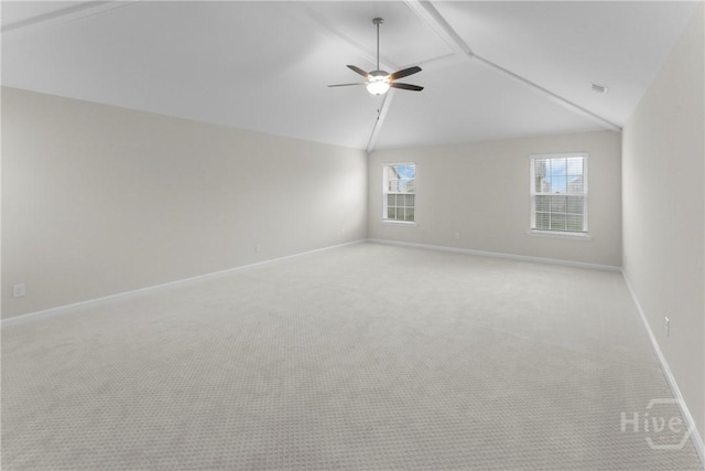 106 Kenwood Cir, Savannah, GA 31302 - spare room with vaulted ceiling, a ceiling fan, light colored carpet, and baseboards