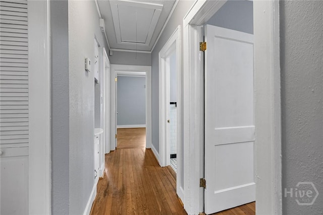 1419 E 35th St, Savannah, GA 31404 - corridor featuring attic access, wood-type flooring, and a textured wall