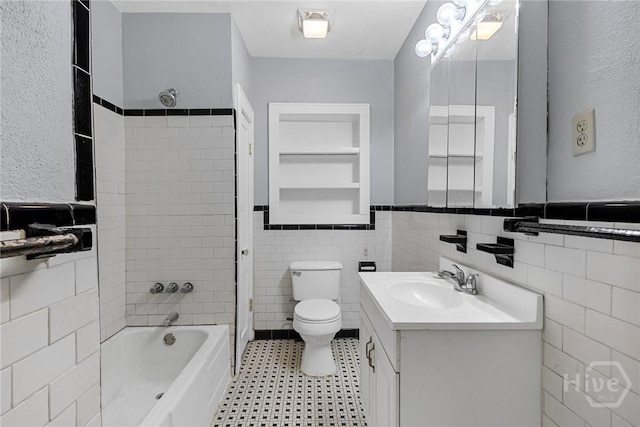 1419 E 35th St, Savannah, GA 31404 - bathroom featuring tile walls, vanity, a wainscoted wall, and shower / bathtub combination
