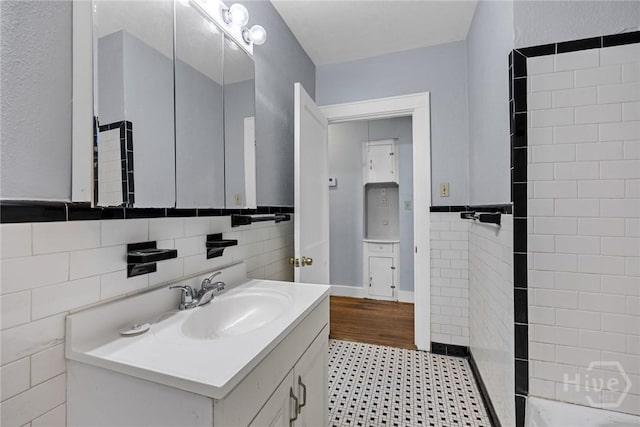 1419 E 35th St, Savannah, GA 31404 - bathroom with vanity, tile walls, and radiator