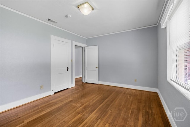 1419 E 35th St, Savannah, GA 31404 - spare room with crown molding, wood-type flooring, and a smoke detector