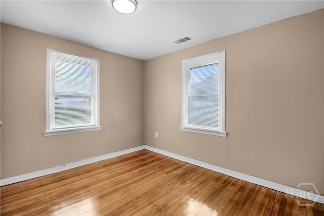3114 Wright St, Savannah, GA 31404 - unfurnished room with plenty of natural light, hardwood / wood-style flooring, and baseboards