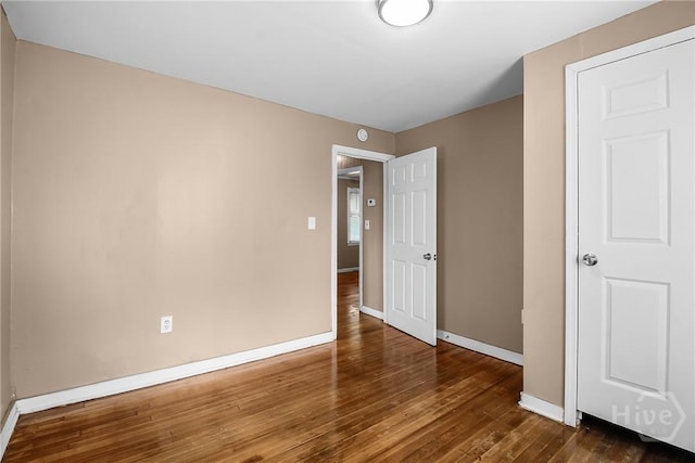 3114 Wright St, Savannah, GA 31404 - unfurnished bedroom with wood-type flooring and baseboards