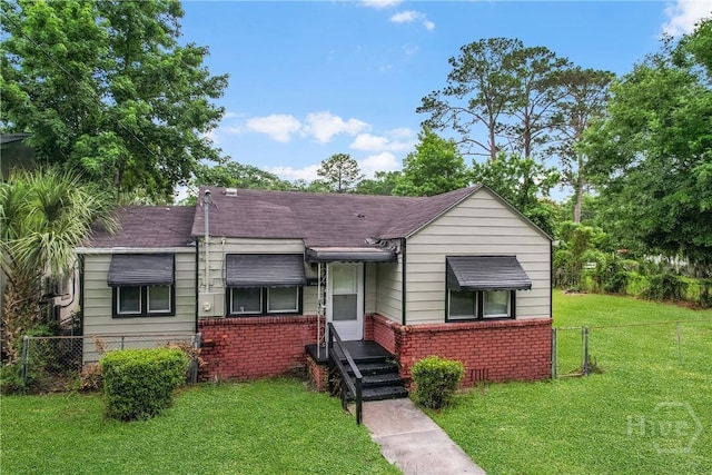 3114 Wright St, Savannah, GA 31404 - bungalow-style home with brick siding and roof with shingles