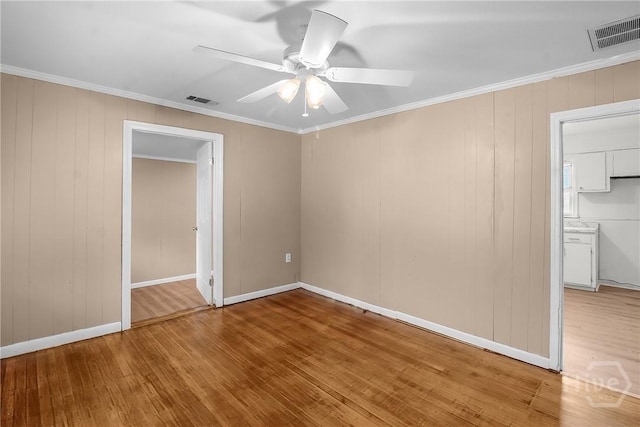 3114 Wright St, Savannah, GA 31404 - spare room with wood finished floors, a ceiling fan, ornamental molding, and baseboards