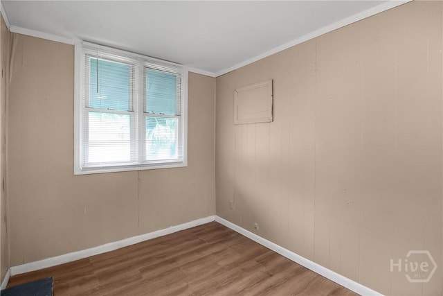 3114 Wright St, Savannah, GA 31404 - empty room featuring wood finished floors, baseboards, and crown molding