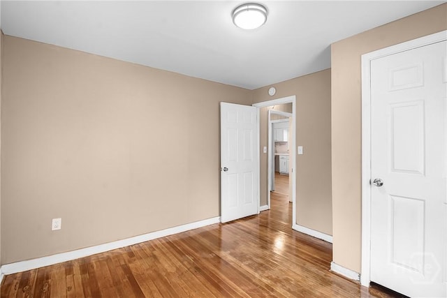 3114 Wright St, Savannah, GA 31404 - unfurnished bedroom featuring wood-type flooring and baseboards