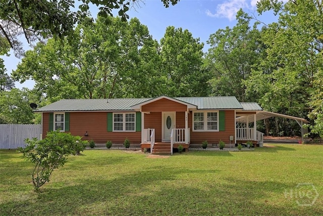 142 Bill Brown Rd, Pembroke, GA 31321 - view of front of property featuring a metal roof and a carport