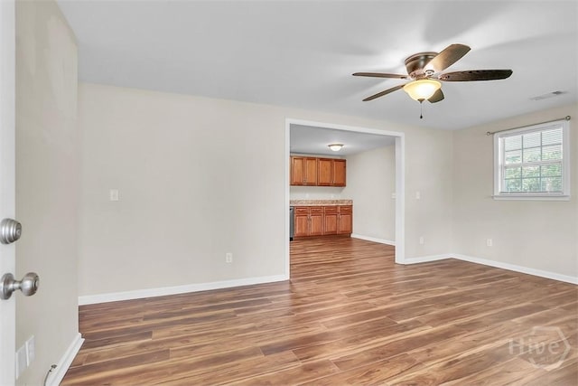 142 Bill Brown Rd, Pembroke, GA 31321 - empty room with wood finished floors and a ceiling fan