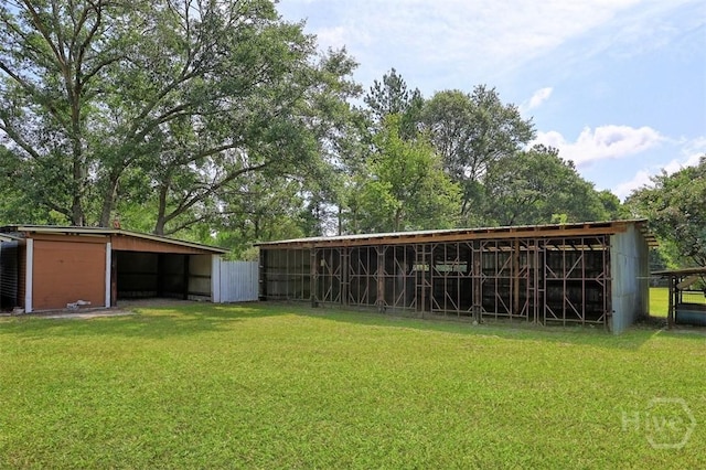 142 Bill Brown Rd, Pembroke, GA 31321 - view of grassy yard with an outbuilding and an outdoor structure