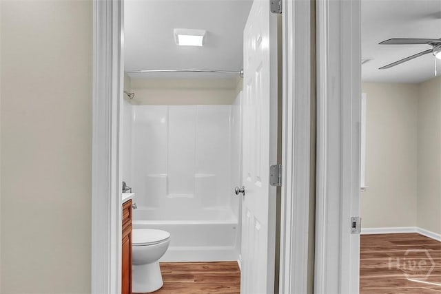 142 Bill Brown Rd, Pembroke, GA 31321 - full bath with wood finished floors, a ceiling fan, vanity, and tub / shower combination