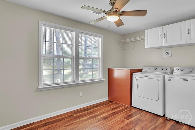 142 Bill Brown Rd, Pembroke, GA 31321 - washroom with cabinet space, independent washer and dryer, wood finished floors, and ceiling fan