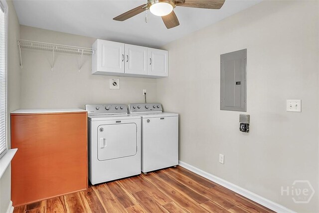 142 Bill Brown Rd, Pembroke, GA 31321 - laundry room featuring electric panel, cabinet space, independent washer and dryer, light wood-type flooring, and ceiling fan