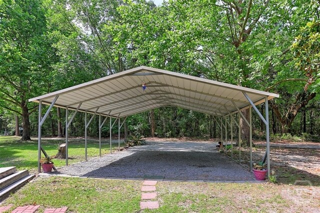 142 Bill Brown Rd, Pembroke, GA 31321 - view of parking featuring a detached carport