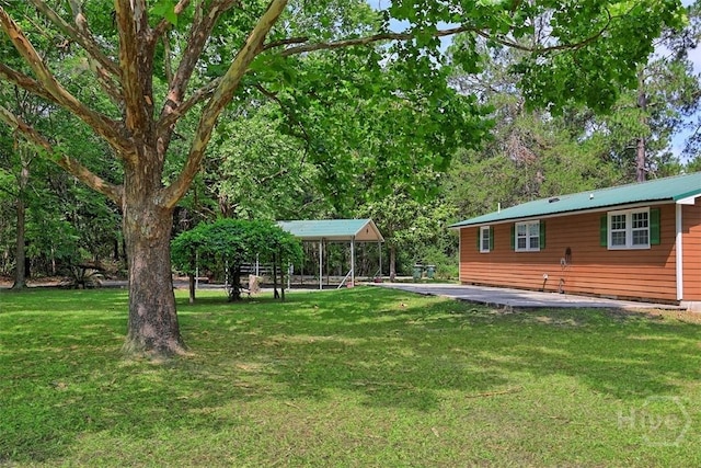 142 Bill Brown Rd, Pembroke, GA 31321 - view of grassy yard with a carport and a gazebo
