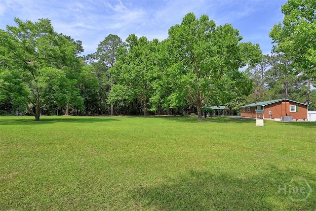142 Bill Brown Rd, Pembroke, GA 31321 - view of green lawn featuring view of scattered trees