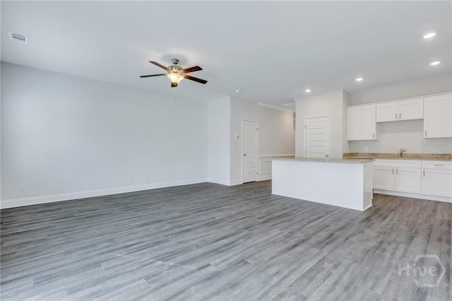 343 Governor Gwinnett Way, Pooler, GA 31322 - kitchen featuring recessed lighting, open floor plan, wood finished floors, white cabinetry, and a ceiling fan