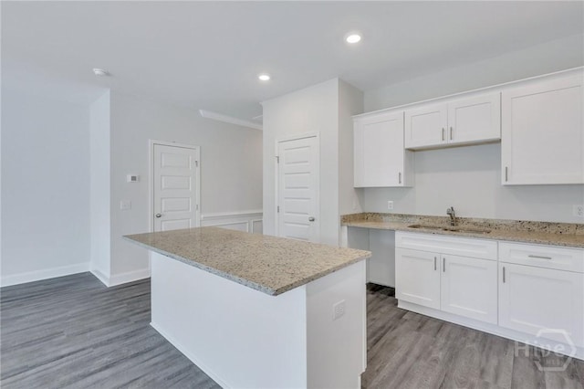 343 Governor Gwinnett Way, Pooler, GA 31322 - kitchen with a sink, light wood finished floors, white cabinetry, light stone countertops, and recessed lighting