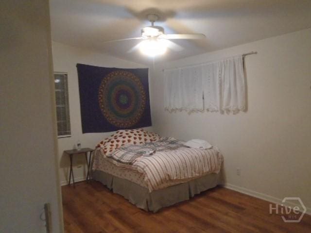 506 Mclaws St, Savannah, GA 31405 - bedroom featuring wood finished floors, baseboards, and ceiling fan