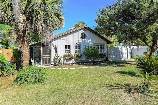 1810 Chatham Ave, Tybee Island, GA 31328 - back of house with a sunroom