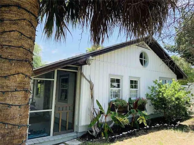 1810 Chatham Ave, Tybee Island, GA 31328 - view of property exterior with a sunroom