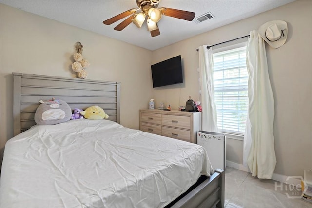 1346 Ryans Way, Pooler, GA 31322 - bedroom featuring baseboards, a ceiling fan, and light tile patterned flooring