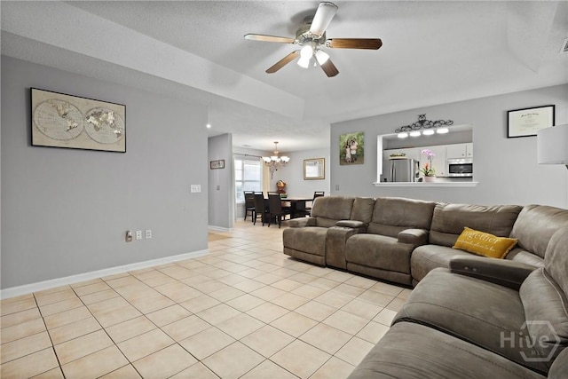 1346 Ryans Way, Pooler, GA 31322 - living room featuring a chandelier, light tile patterned flooring, a ceiling fan, and baseboards