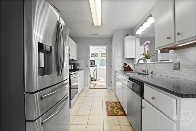 1346 Ryans Way, Pooler, GA 31322 - kitchen with appliances with stainless steel finishes, a sink, tasteful backsplash, and white cabinets