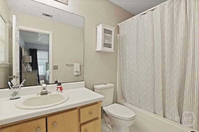 1346 Ryans Way, Pooler, GA 31322 - ensuite bathroom with vanity, shower / bath combo with shower curtain, toilet, and a textured ceiling
