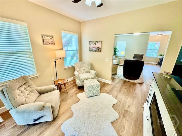 174 Regency Cir, Pooler, GA 31322 - living room with wood finished floors, a ceiling fan, and baseboards