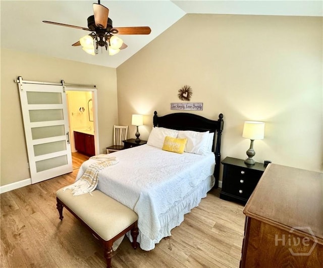 174 Regency Cir, Pooler, GA 31322 - bedroom featuring light wood finished floors, lofted ceiling, a barn door, connected bathroom, and a ceiling fan