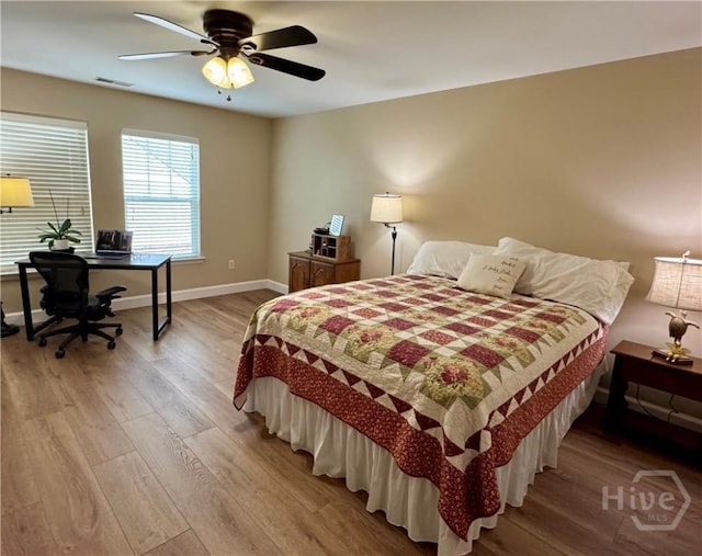 174 Regency Cir, Pooler, GA 31322 - bedroom with wood finished floors, a desk, baseboards, and ceiling fan