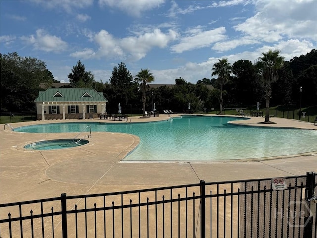 174 Regency Cir, Pooler, GA 31322 - community pool with view of scattered trees, a patio area, and a community hot tub