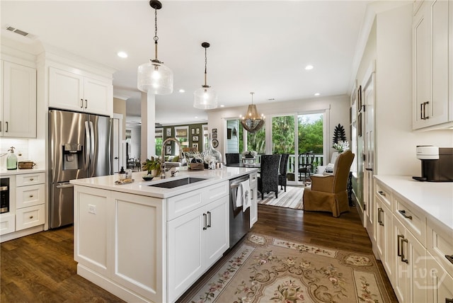 122 N St, Savannah, GA 31410 - kitchen featuring appliances with stainless steel finishes, a sink, dark wood-style floors, recessed lighting, and healthy amount of natural light