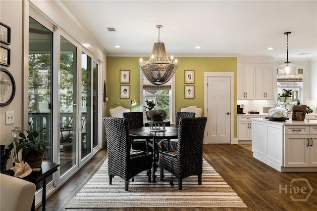 122 N St, Savannah, GA 31410 - dining space with a chandelier, dark wood-style flooring, crown molding, and recessed lighting